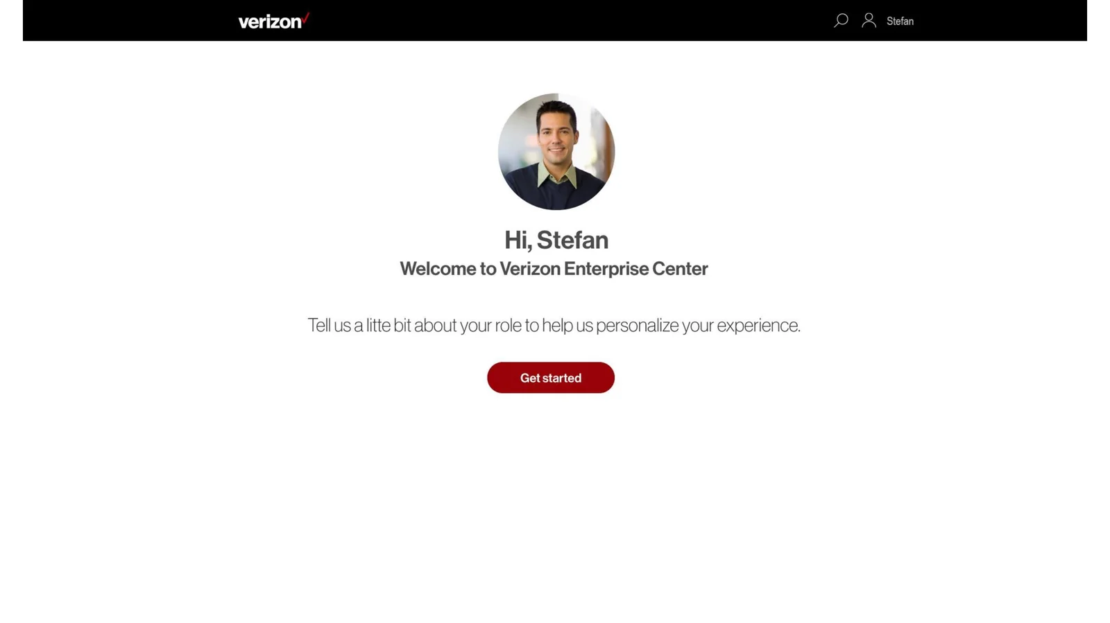 Verizon Enterprise Center personalization onboarding screen. Centered layout featuring a profile photograph of a male user, headline 'Hi, Stefan' followed by 'Welcome to Verizon Enterprise Center,' a one-line invitation reading 'Tell us a little bit about your role to help us personalize your experience,' and a primary Get started button rendered as a red pill.
